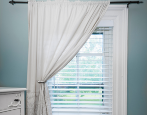 How to Hang Curtains Over Vertical Blinds